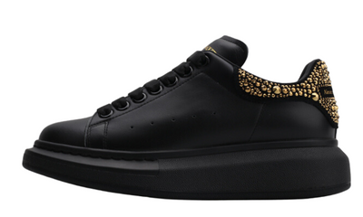 Cauda de diamante totalmente preta e dourada